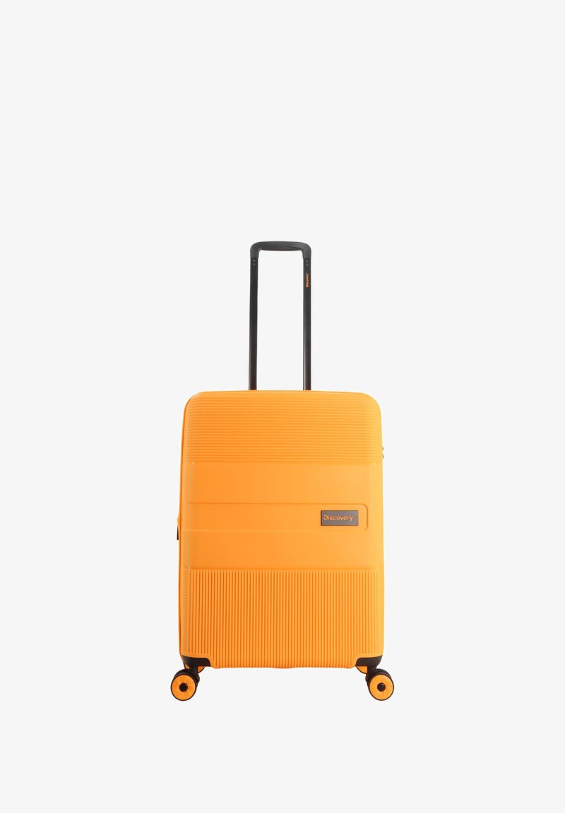 Hard-shell orange suitcase with horizontal ribbed texture, black telescopic handle, and four black wheels for mobility. Brand label visible.