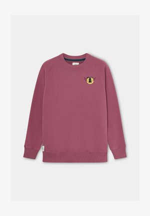 Sudadera rosa con puños y dobladillo acanalados. Presenta un pequeño logo gráfico en negro y amarillo en el pecho. Textura suave y corte regular.