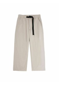 Beige broek met een elastische tailleband, zwarte trekkoord en twee zijzakken. Gladde textuur, rechte snit en minimaal ontwerp.