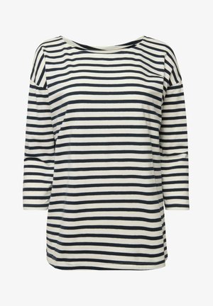 Pruhovaný dámský top s dlouhými rukávy v krémové a námořnické modré barvě, s širokým lodním výstřihem a volným střihem. Hladká, lehká látka s vodorovnými pruhy.