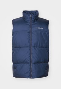 Polstrovaná tmavě modrá vesta s vysokým límcem, zapínáním na zip vpředu a logem Columbia na levé horní straně. Materiál je hladký a strukturovaný.