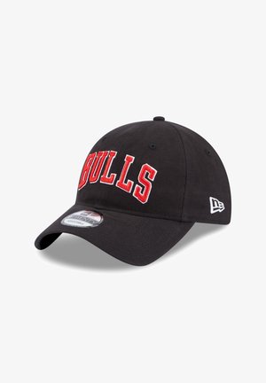 Black baseball cap with red "BULLS" embroidery on the front, curved brim, and adjustable back strap; features logo on the side.