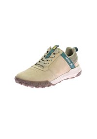 Scarpa sportiva beige con tomaia in suede liscia, dettagli in teal e suola in gomma con un motivo di grip testurizzato. Lace e branding visibili.