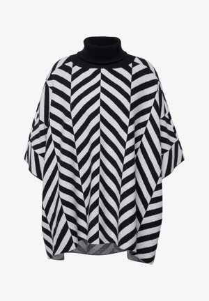 Mustapekka ja valkoinen poncho korkean kauluksen kanssa, jossa on chevron-kuvio. Tehty pehmeästä, teksturoidusta kankaasta, leveillä hihoilla ja löysällä istuvuudella.