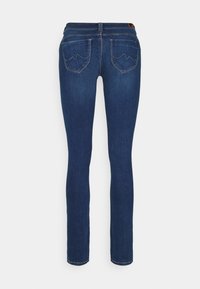 Dark blue skinny jeans with a smooth texture, featuring two back pockets with a wavy stitch design and a classic waistband.