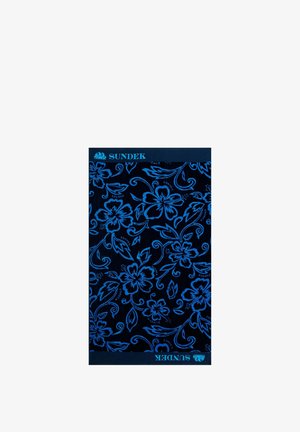 Asciugamano blu intenso con un motivo floreale ripetuto in blu brillante. Logo del marchio "SUNDEK" visibile sui bordi superiore e inferiore.