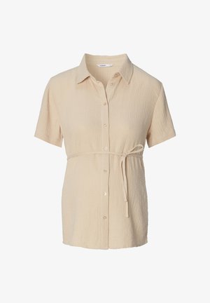 Koszula z krótkim rękawem w jasnym beżowym kolorze, wykonana z teksturowanej tkaniny, z zapięciem na guziki z przodu, kołnierzykiem i wiązanym akcentem w talii dla regulowanego dopasowania.