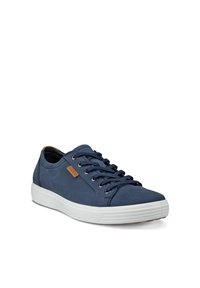 Navy blue low-top sneaker with white sole, lace-up front, and brown brand tag on side, shown from angle on white background.