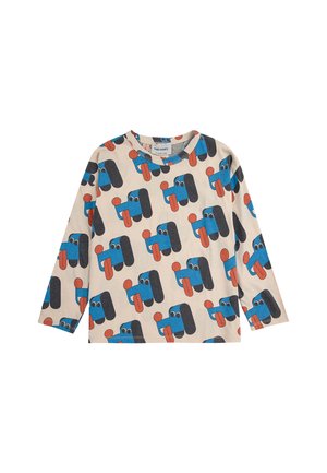 Long-sleeve, light beige shirt featuring a playful pattern of cartoonish blue dogs with red tongues and black accents. Made from soft fabric.
