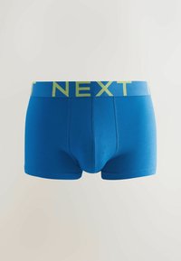 Modré bavlněné boxerkové trenýrky s žlutým logem "NEXT" na elastickém pásku. Mají přiléhavý střih a hladkou texturu.