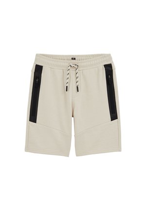Béžové šortky s elastickým pásom, čiernymi zvislými vreckami na zips na oboch stranách a bielym šnúrkou s čiernymi akcentmi.