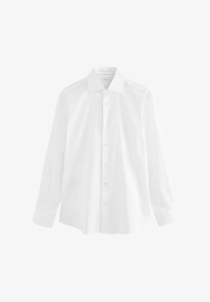 Fehér, hosszú ujjú ing, sima pamut anyagból készült. Klasszikus gallérral, gombos elülső résszel és laza fazonnal rendelkezik, egyenes szegéllyel.