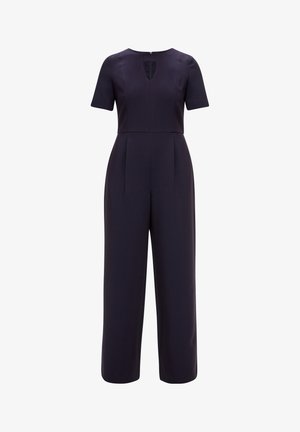 Laivasilta sininen haalari, lyhyet hihat, V-muotoinen kaula-aukko, istuva paita, jossa on laskoksia, leveälahkeiset housut, viimeistelty piilotetulla takavetoketjulla.