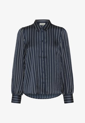 Camicia blu navy con sottili righe verticali bianche, chiusura frontale con bottoni e maniche lunghe a sbuffo. Realizzata in tessuto liscio; presenta un colletto a fascia.