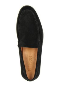 Zwarte suède instapschoen met een ronde neus, contrasterende witte zool en gestikte details langs de bovenkant. Het interieur heeft een bruine binnenzool.