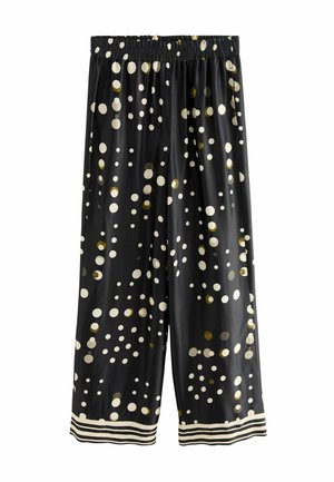 Schwarze Hose mit weitem Bein und elastischem Bund, versehen mit verstreuten weißen und goldenen Punkten sowie gestreiften Säumen.