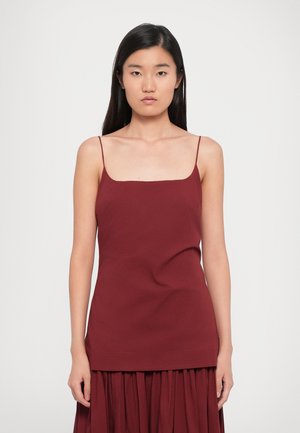 Burgundy sleeveless top with a square neckline and slim straps, made of soft fabric, smooth texture, fitted silhouette.