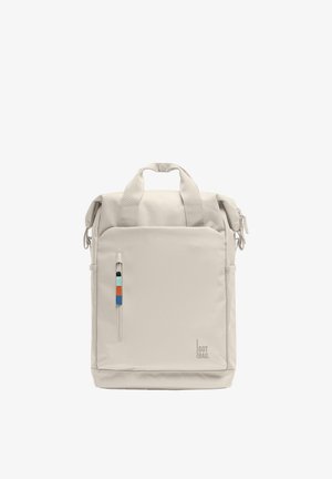 Rectangular beige backpack with dual handles, front zipper pocket with multicolor pull tab, and "GOT BAG." logo at the bottom right corner.