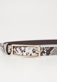 Brown and white faux snake print belt with a gold-tone rectangular buckle and smooth texture. Features holes for adjustment.