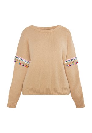 Beige neulepusero, jossa on pyöreä kaula-aukko, ja värikkäitä tupsuja sekä brodeerauksia hihoissa. Pehmeä pinta ja ribbaatut hihansuut.