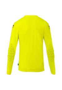 Chemise à manches longues de couleur jaune vif, avec des coudières texturées et un design à col rond. Fabriquée en tissu lisse et léger.
