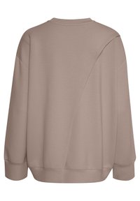 Sudadera extragrande en beige. Tela suave con cuello redondo, hombros caídos y un diseño de costura asimétrico en la parte trasera. Mangas largas.