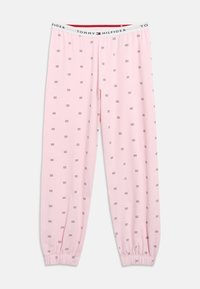 Svetloružové pyžamové nohavice Tommy Hilfiger s malými potlačami loga, elastickým pásom a elastickými manžetami na členkoch.