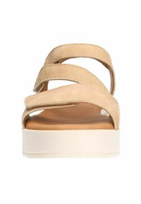 Beige suede sandals with three crossed straps, open toe design, and a white platform sole. Soft texture and minimalistic style.