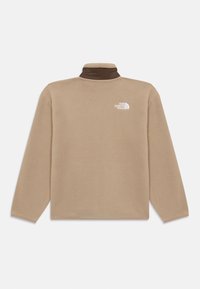 Beige fleecegenser med høy hals, brun innerribbing og hvit logo på venstre bryst. Har lange ermer og teksturert stoff.