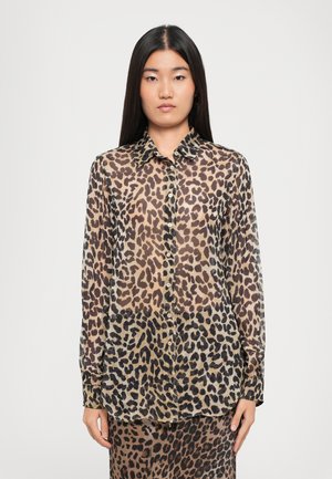 Leopard print blouse with a sheer, lightweight fabric. Features a collared neckline, button front, and long sleeves.