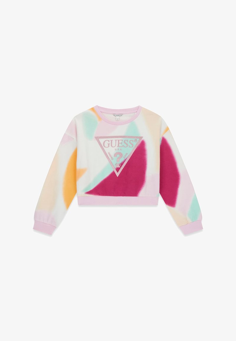 Sweat-shirt court de couleur pastel avec motifs tie-dye en rose, orange et bleu sarcelle, avec un grand logo Guess pailleté à l’avant.