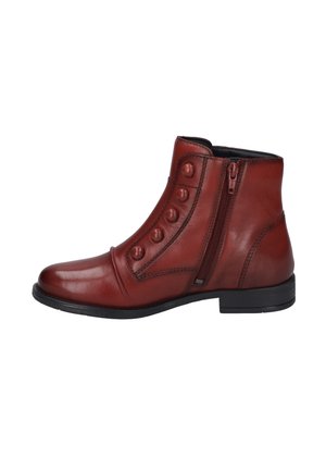 Braune Leder-Stiefeletten mit runder Zehenpartie, seitlichem Reißverschluss und sechs dekorativen Knöpfen entlang der Außenseite. Flache schwarze Sohle.