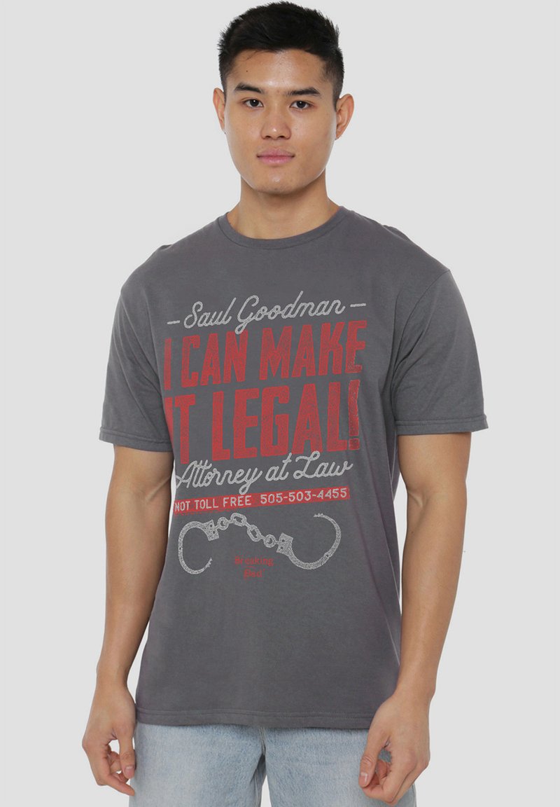 Gray cotton t-shirt featuring printed text in red and white with a handcuff graphic. Short sleeves and crew neckline. Casual fit.