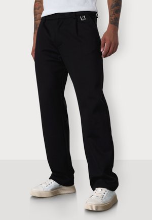 ICON - Trousers - black