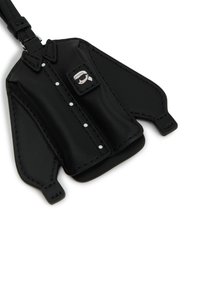 Black leather keychain shaped like a shirt, featuring buttons, a chest pocket, and a small logo patch. Includes a loop for attachment.