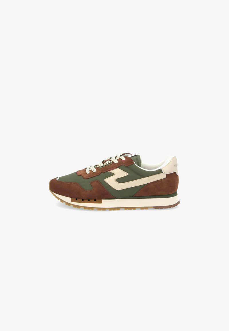 Sneakers feature a green and brown suede upper with a cream accent logo. Laced design and rubber sole with a textured finish.