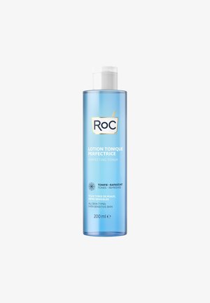 Clear plastic bottle with a white cap; blue liquid inside. Label features "RoC" logo, product name, volume, and multilingual text on skin types.