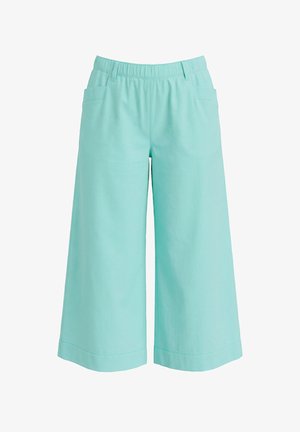 Hellblaue weite, gekürzte Hosen mit elastischem Bund und seitlichen Taschen, geeignet für legere Kleidung.