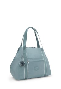 Teal fabric bag with a structured shape, featuring a zippered main compartment, front pocket, and side stripes, accented by a fuzzy keychain.