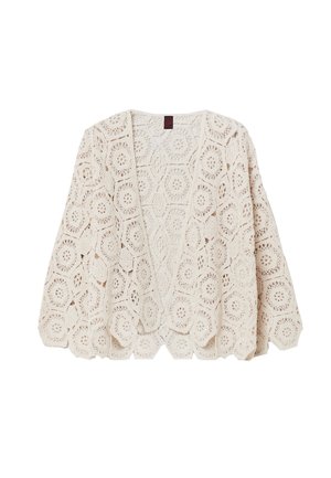 Kantgebreide cardigan in crème, met hexagonale patronen, open voorkant, brede mouwen en een losse pasvorm. Zachte textuur en ademend ontwerp.