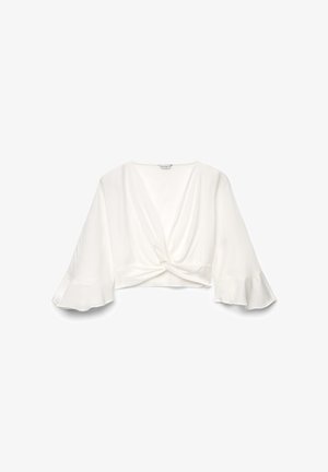 Blouse blanche raccourcie avec un décolleté en V profond, détail noué à l'avant et larges manches cloche.