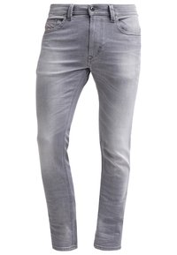 Šedé džíny s úzkým střihem, s knoflíkovým zapínáním, předními kapsami a jemným zesvětlením na nohavicích pro texturu.