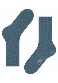 Calzini blu a coste realizzati in un morbido tessuto, con una struttura della punta senza cuciture e il logo del marchio nella parte inferiore.