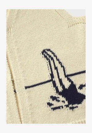 Beige knitted fabric with black and white patterned design resembling a hand reaching across a horizontal line.