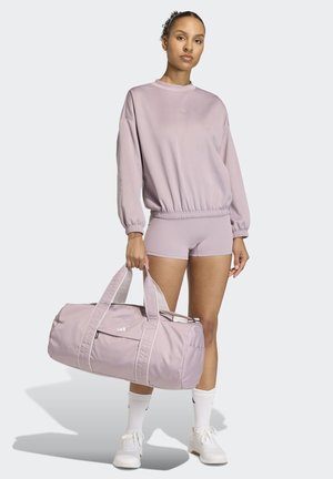 Light purple sports outfit featuring a long-sleeve top and shorts, paired with a matching duffle bag, both made from smooth fabric.