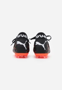 Puma Botines de fútbol para terreno firme - black