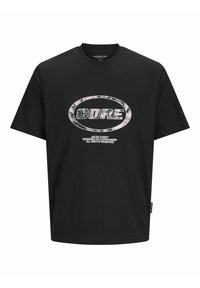 Schwarzes Baumwoll-T-Shirt mit Rundhalsausschnitt. Mit einem großen ovalen grafischen Aufdruck in Silber und Weiß, der "CORE" zentriert auf der Brust trägt.