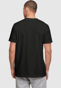 ABSOLUTE CULT DISNEY  LILO & STITCH STITCH BACKSIDE BREAST - Camiseta estampada - black