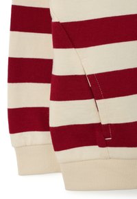 Gestreepte trui met brede rode en crèmekleurige horizontale strepen. Zachte gebreide stof met geribde manchetten en een zijnaaddetail.