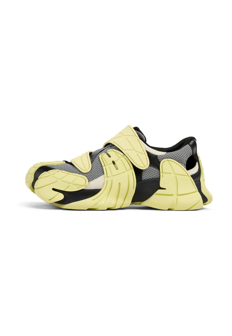 Sport shoe with a mesh upper in gray, yellow accents, and a black sole. Features adjustable straps and a unique, elongated toe design.